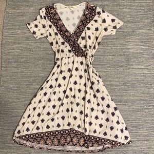 Medium; blue, white and pink patterned dress.